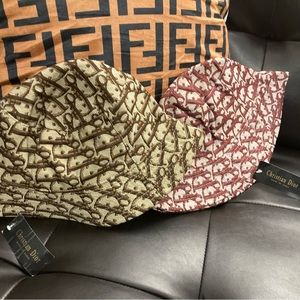Christian Dior bucket hat color is brown and red brand new with tags on them